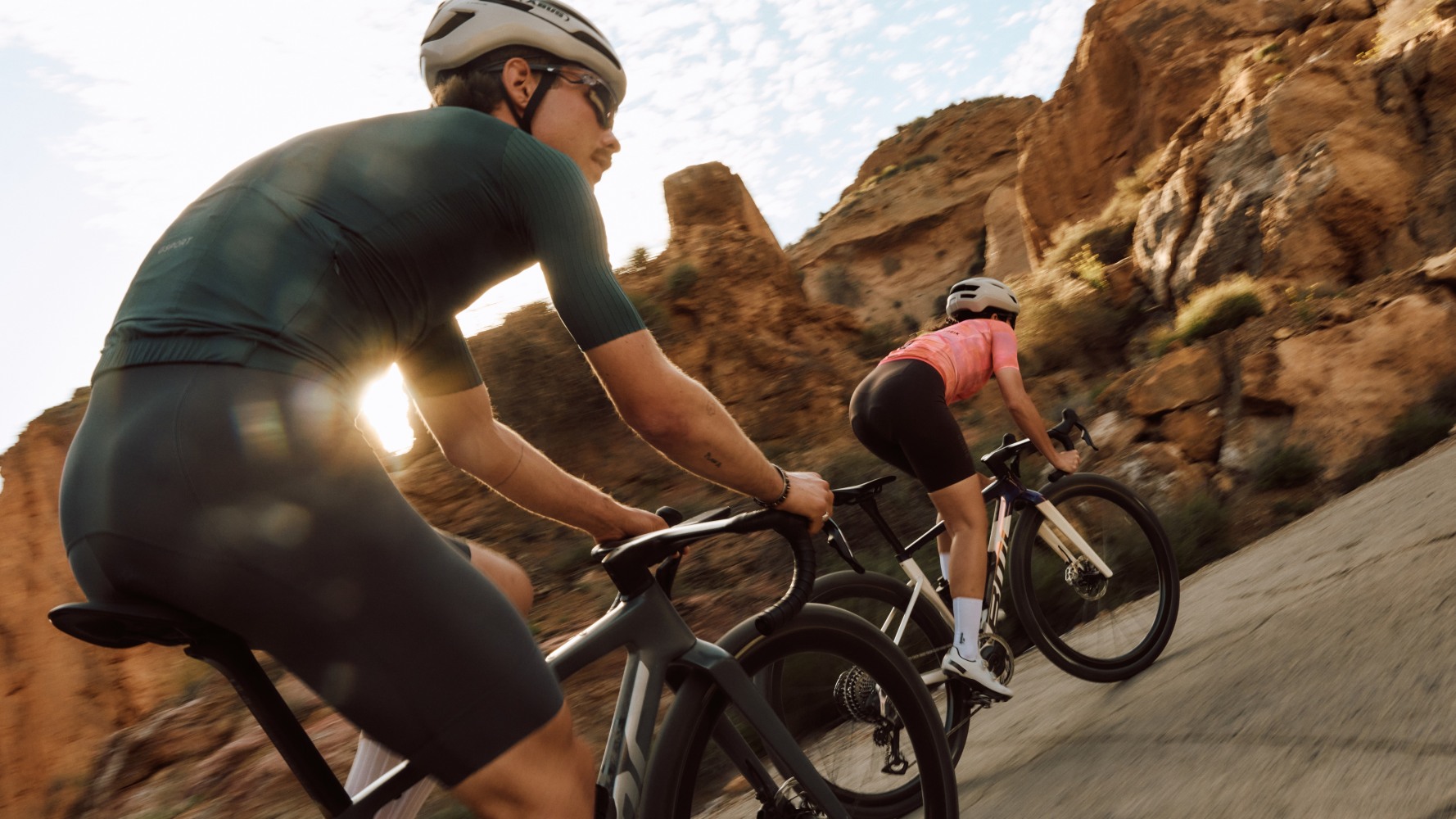Man and woman riding gravel bikes