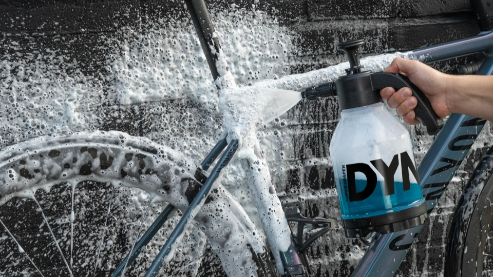 Bike being sprayed with cleaning foam