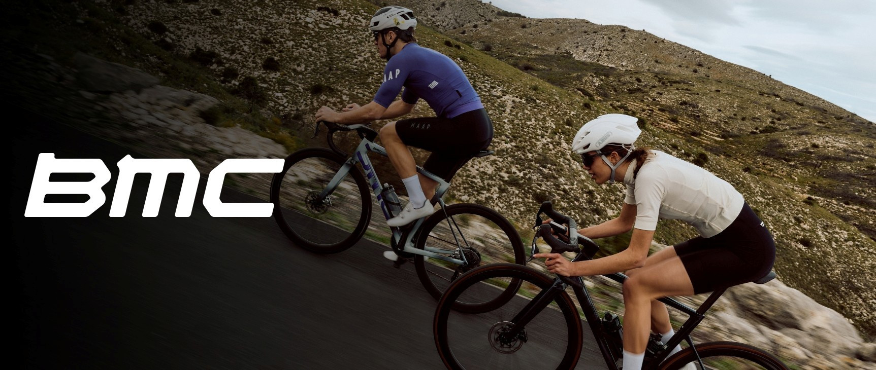 Man and women riding road bikes