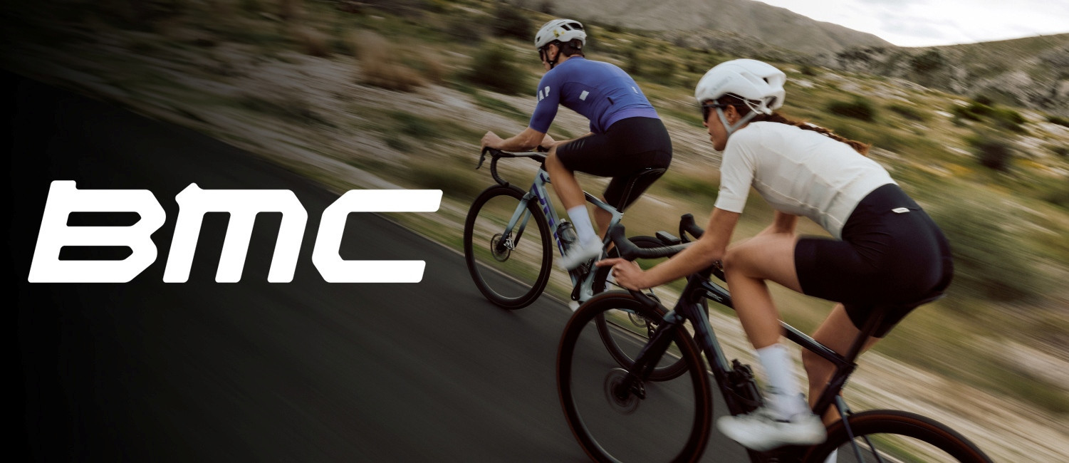 Man and woman riding road bikes