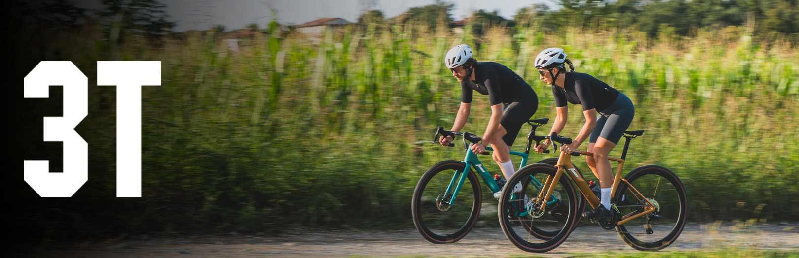Man and woman riding gravel bikes