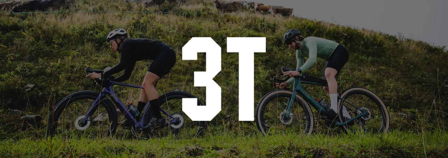 Man and woman riding a gravel bike
