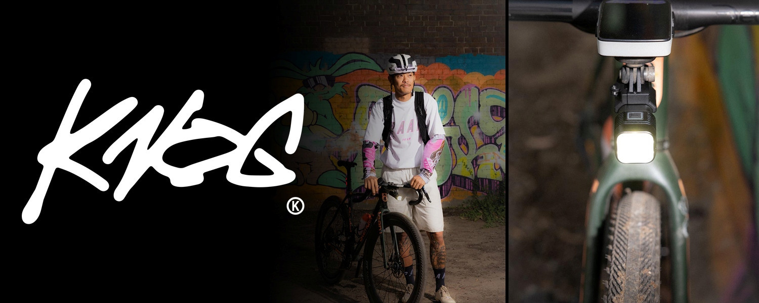 Man holding a bicycle with a front bike light