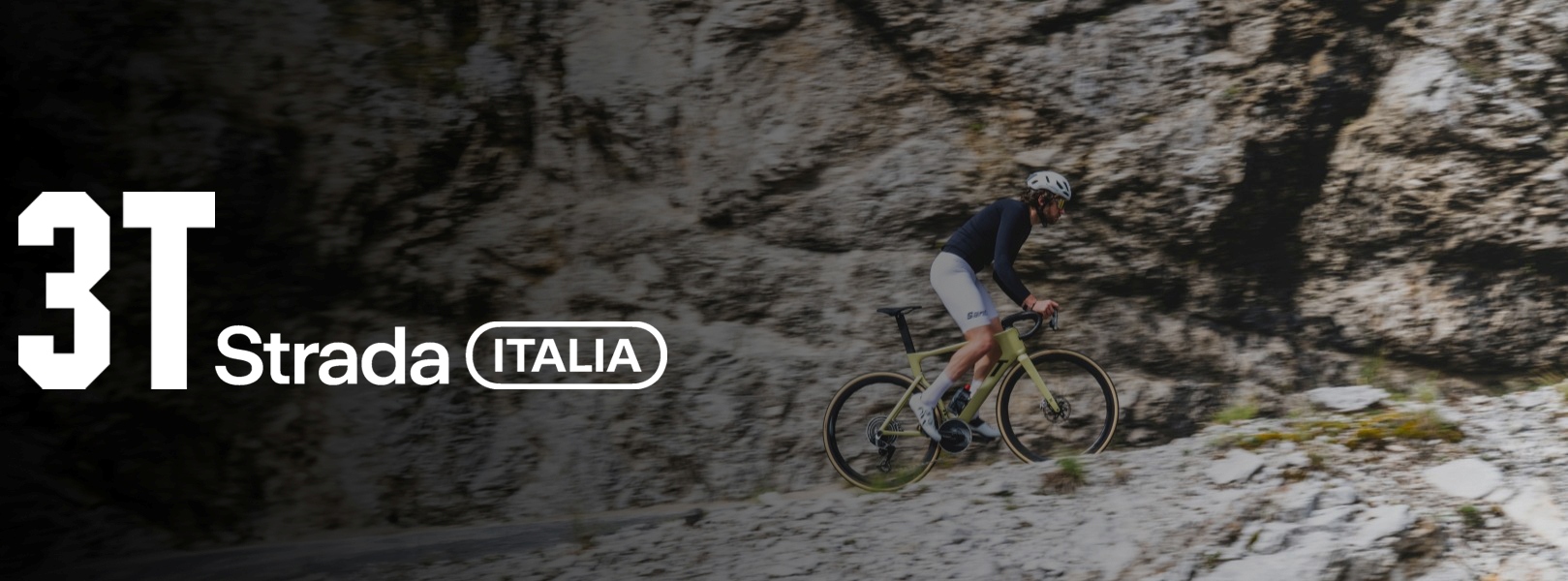 Vyras važiuojantis plentiniu dviračiu į kalną