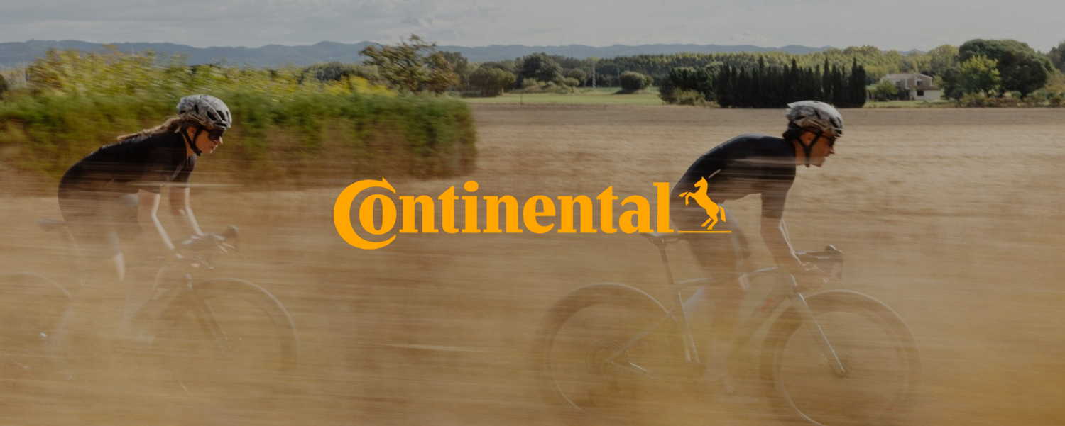 Two cyclists riding on gravel roads