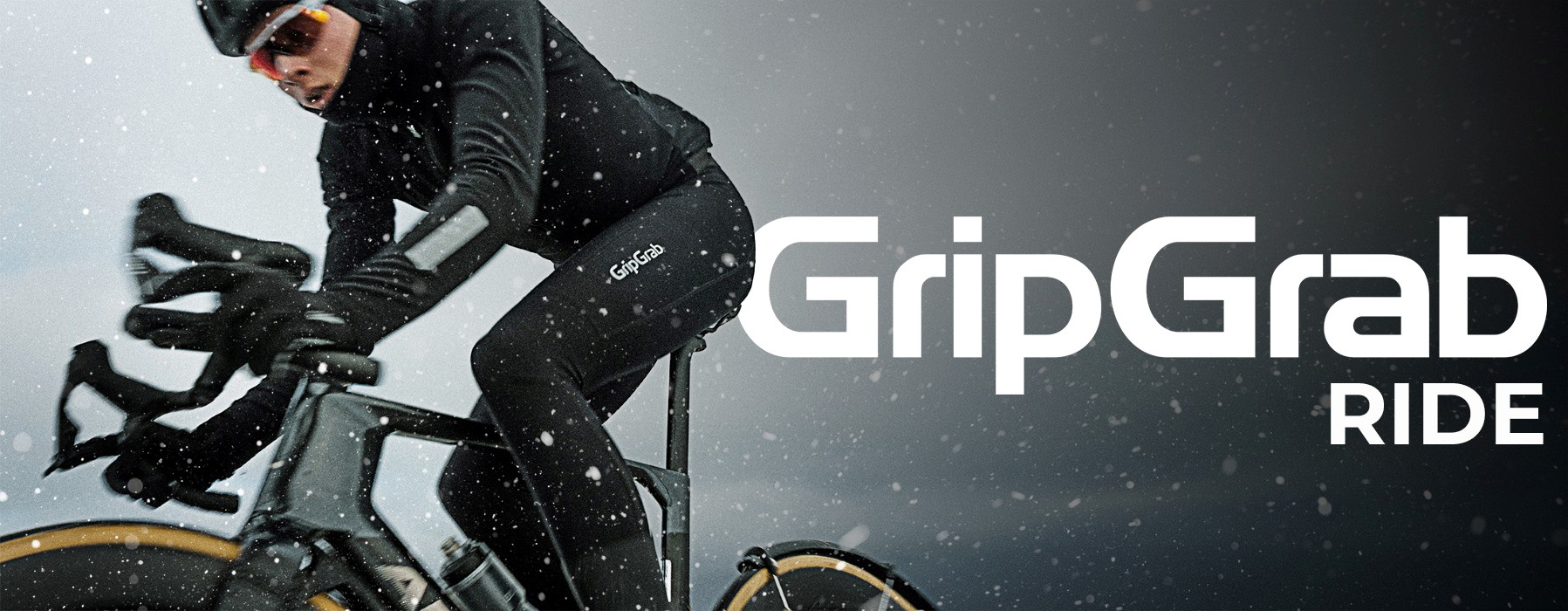 Man riding a bicycle in the snow