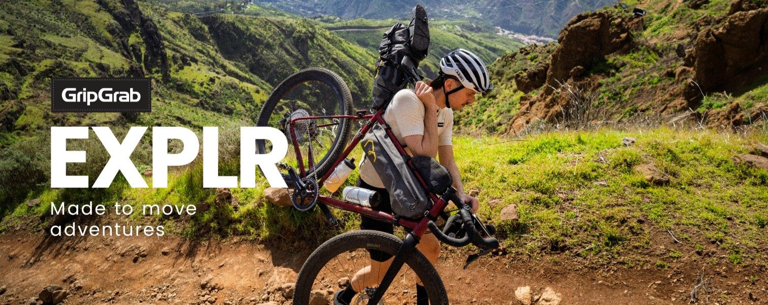 Dviratininkas nešantis dviratį