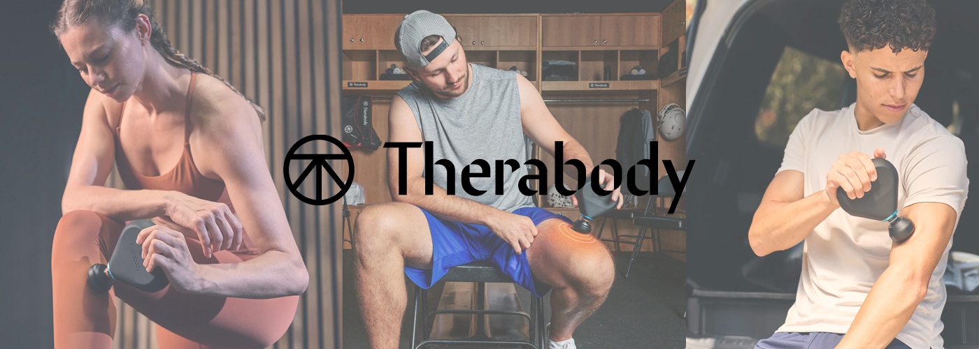 People using a percussive massage gun in a gym environment