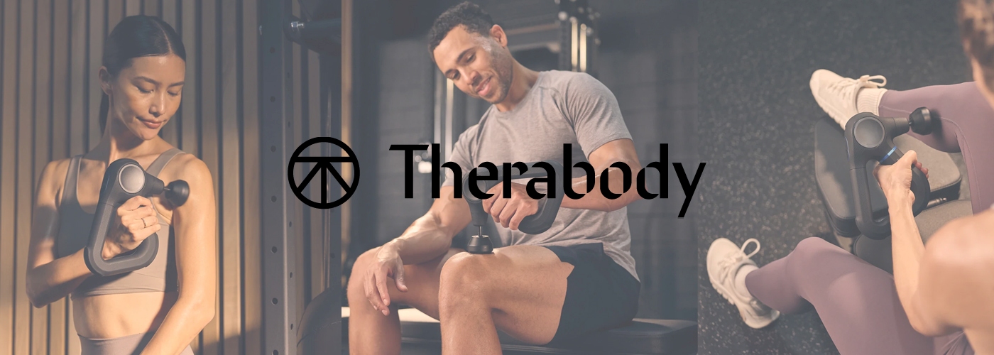 People using a percussive massage gun in a gym environment