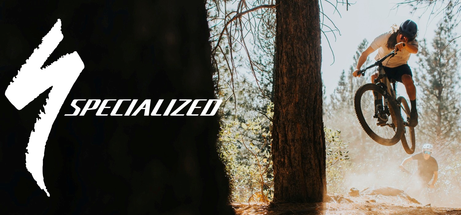 Cyclist jumping over a trail feature